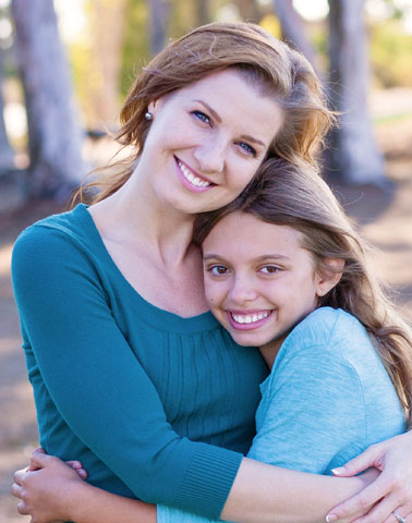 Woman and daughter smiling