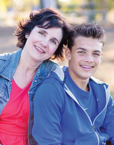 Mom and son smiling